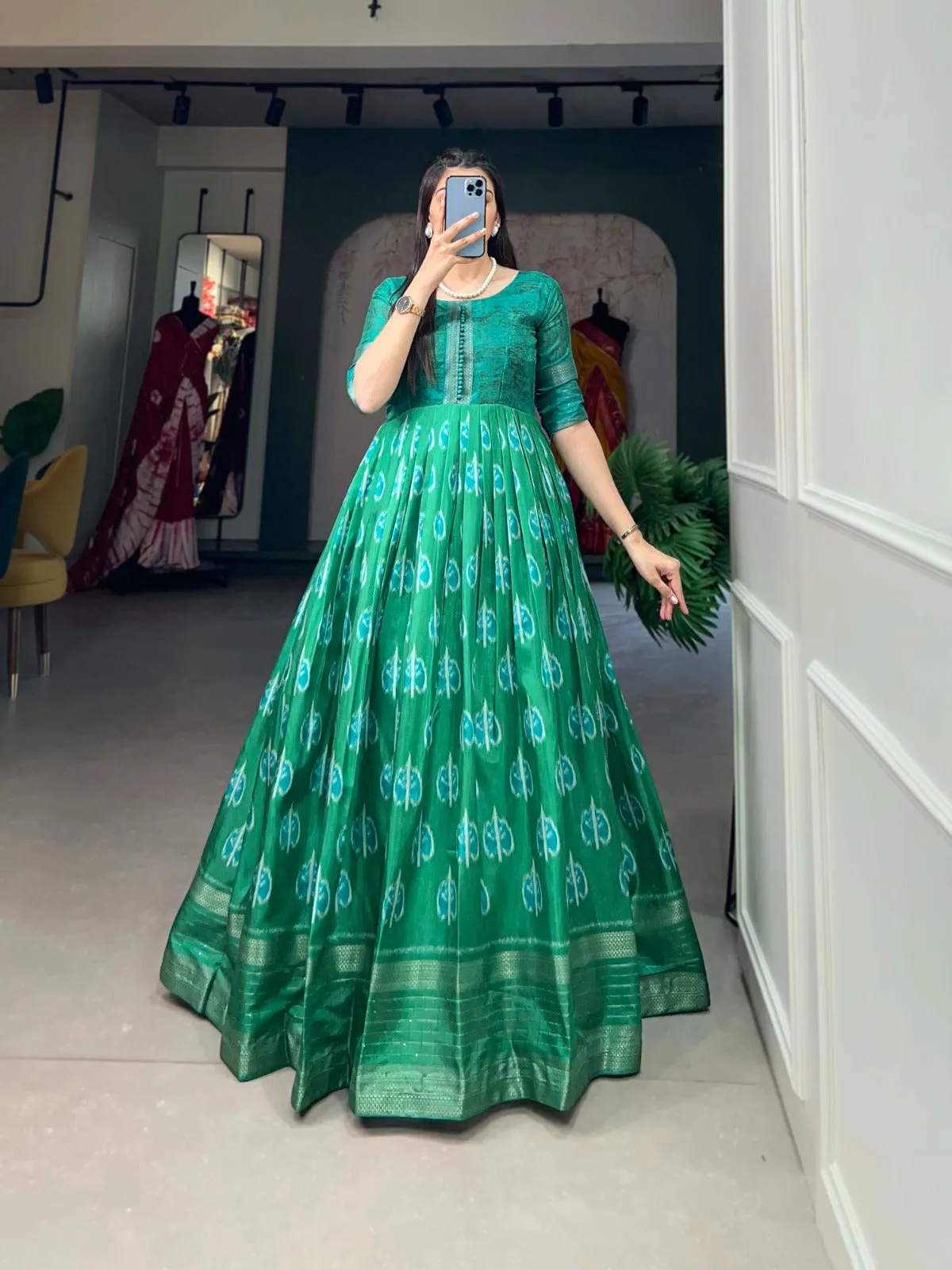 Green Color Dola Silk Printed Gown with Exquisite Zari Border